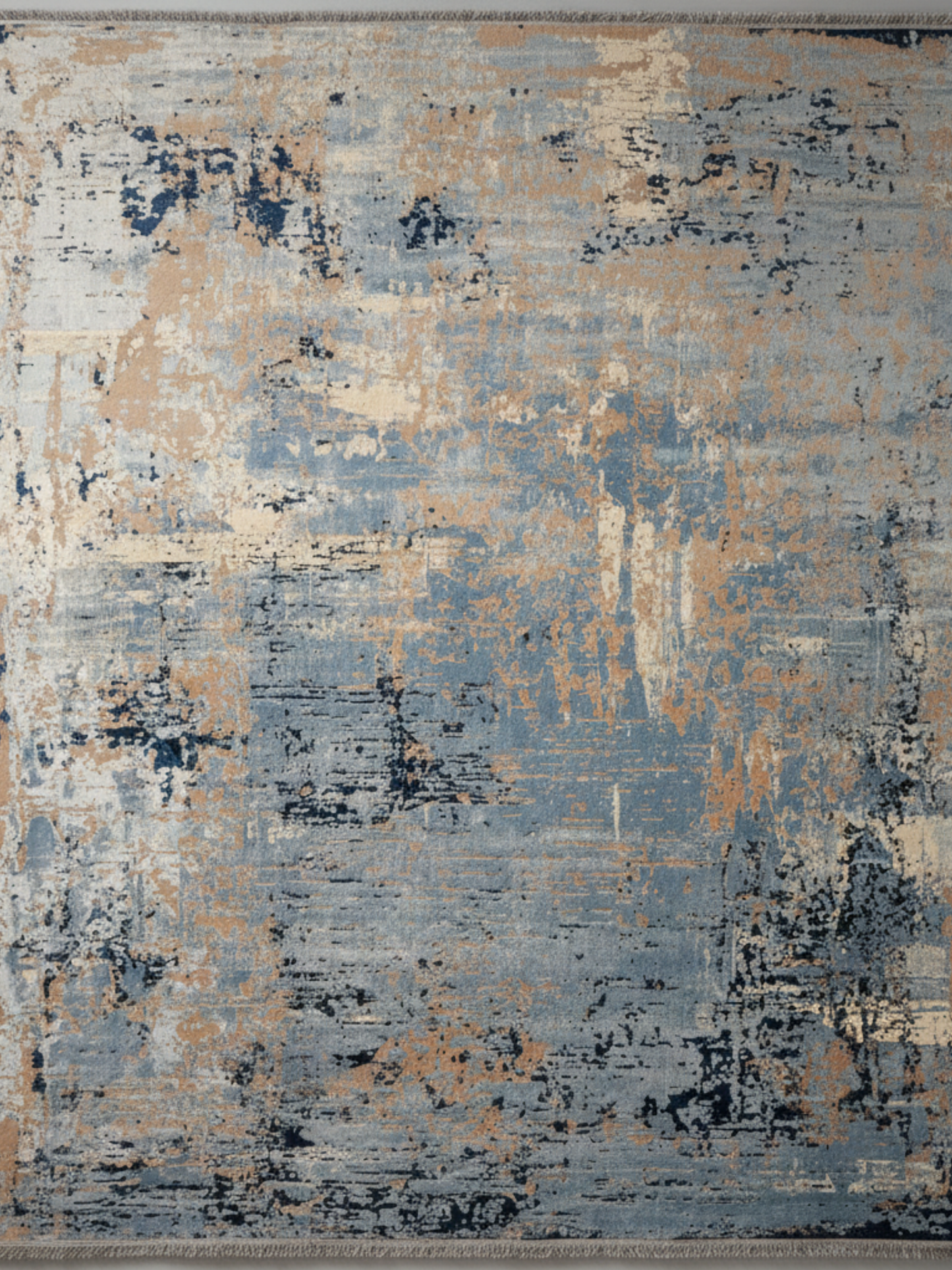 Abstract patterned rug on a plain background
