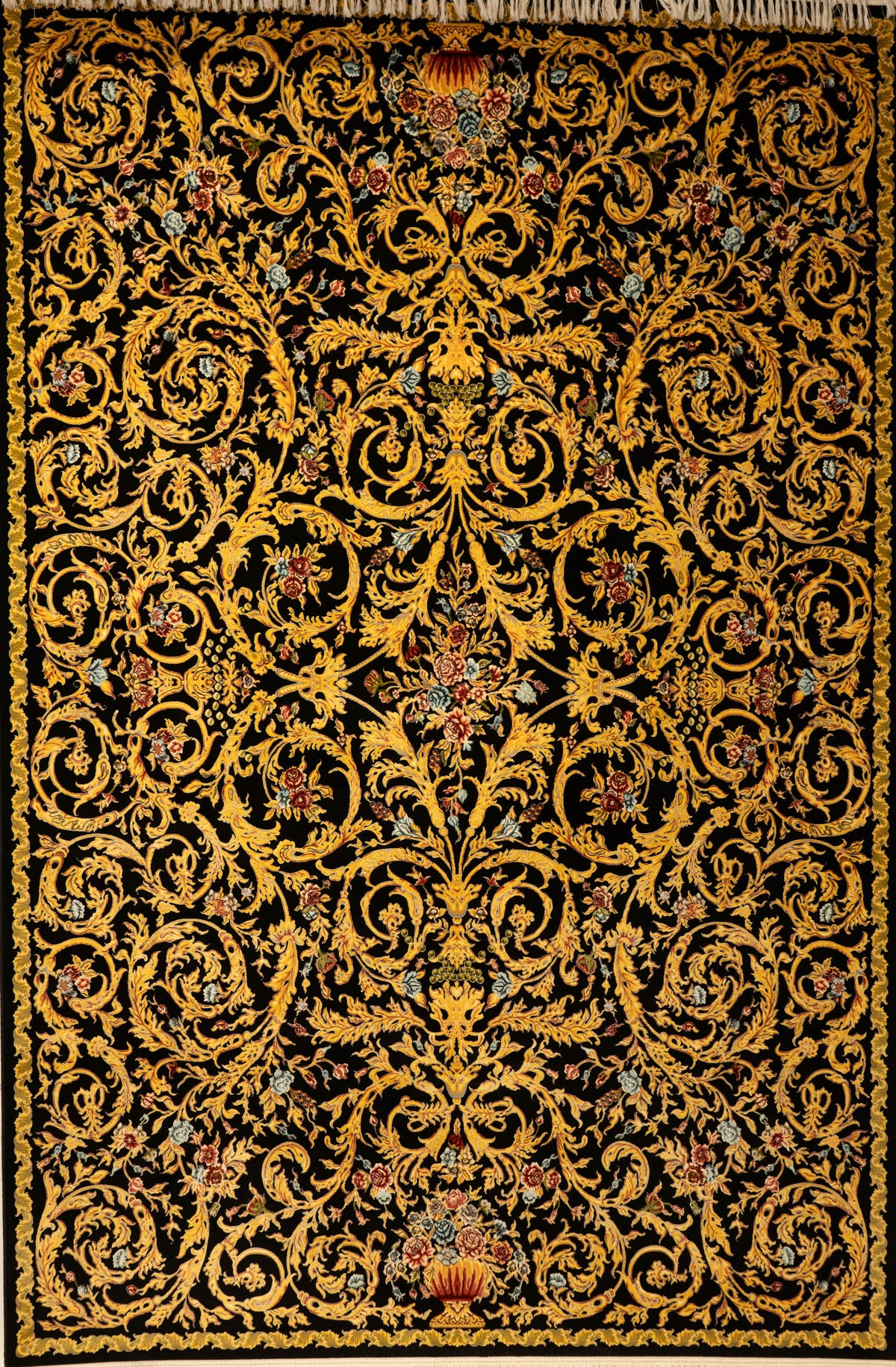 Decorative rug with intricate gold pattern on a black background